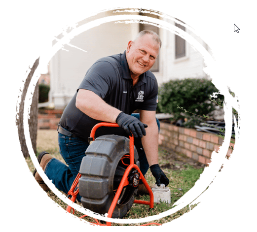 Professional plumber in front yard checking sewer line